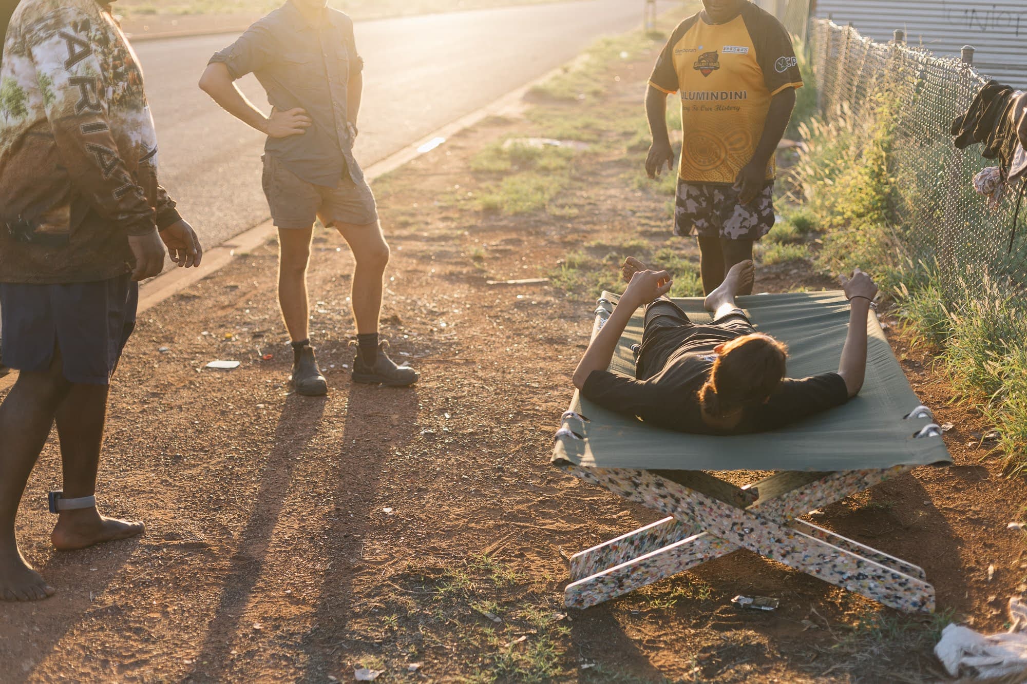 Community member testing the Stretch Bed at golden hour