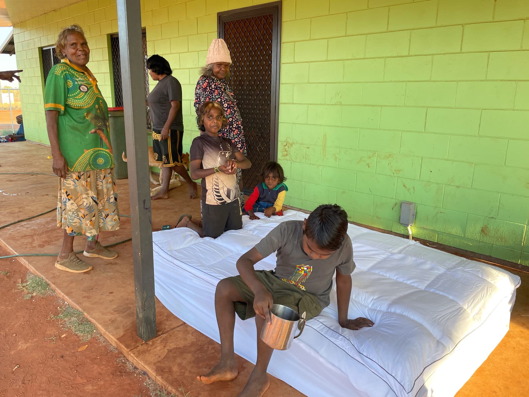 A Stretch Bed being tested on a homelands verandah